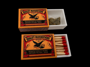 Matchbox with discreet hidden storage compartment